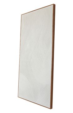 a white and wood framed art piece on a wall