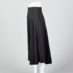 "This listing is for one skirt. Textile is unmarked. Full skirt with pleated waistband. This is a very lovely black skirt with a nice sweep. Beautiful drape and movement. Wide waistband with horizontal pleats. Left side zip with button and loop closures at the waistband. Size Marked: Unmarked Approximate Size: Medium **Please Check Measurements to be Sure! Fabric: Unmarked Lining Type: None Closure: Zip Label: Unmarked Condition: Excellent Era: 1950s Inventory#: DSC1018-1984 Measurements- Waist: Black Drapes, Vintage Rock, Beautiful Drapes, Womens Skirts, 1950s Vintage, Wide Waistband, Black Skirt, Full Skirt, Vintage Skirt