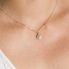 "Our dainty sunflower necklace is our newest addition to our dainty layering necklaces. Sunflowers symbolize adoration, loyalty, and longevity - making it the perfect gift for your loved ones. Available in gold filled or sterling silver. . . . . . . . . . . . . . . . . . . . . . . . . . . . . . . . . . . . . . . . . . . NECKLACE + Length: 16\" + 2\" extender + 14k gold filled -or- sterling silver sunflower 9mm pendant (hollow in back) + 14k gold filled -or- sterling silver spring clasp, jump rin Minimalist Flower Necklace For Weddings, Delicate Flower Pendant Jewelry With Flower Decoration, Delicate Necklace With Flower Charm, Wedding Jewelry With Sunflower Design, Delicate Jewelry With Flower Charm Pendant, Dainty Flower Pendant Necklace For Wedding, Delicate Flower Necklace With Flower Charm, Wedding Necklace With Delicate Flower Chain, Minimalist Flower Necklaces For Bridesmaids