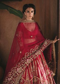 Transitional Red Lehenga With Sheer Dupatta, Red Raw Silk Traditional Wear With Sheer Dupatta, Traditional Sharara With Sheer Dupatta And Kundan, Transitional Red Choli With Sheer Dupatta, Red Chanderi Choli With Dabka Work, Transitional Lehenga With Pallu In Organza, Red Chanderi Floor-length Lehenga, Transitional Chanderi Lehenga With Sheer Dupatta, Red Organza Gown With Resham Embroidery