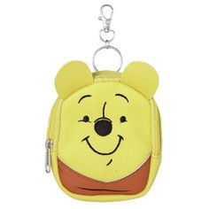 winnie the pooh coin purse keychain is shown with a cartoon face on it