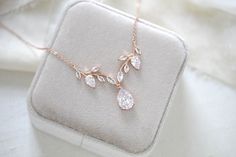 A delicate design with no shortage of sparkle, our simple rose gold cubic zirconia bridal necklace is crafted with Premium Cubic Zirconia stones. Handcrafted to perfection, you will want to wear this necklace long after your wedding day. - Created with Premium Cubic Zirconia stones- Rose gold finish- Available in rose gold, yellow gold, and rhodium finish.- Necklace measures 16 inches and extends to 18 inches- Pendant measures .8 inches x 2.5 inches- Nickel free and hypoallergenic- PLEASE ALLOW Bridal Backdrops, Bridal Backdrop Necklace, Backdrops Necklace, Crystal Bridal Earrings, Cubic Zirconia Bracelet, Simple Rose, Cubic Zirconia Necklace, Cubic Zirconia Earrings, Perfect Palette