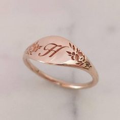 Elegant and unique 14k gold monogram signet ring, Vintage style floral initial ring, personalized engraved signet ring. * Band width: 1.5 mm, wide part width: 7 mm* Thickness: 1.5 mm* Available in 14K or 18K YELLOW, WHITE and ROSE gold.   The price listed is for 14K please contact me for 18K pricing.* Sizes vary from 5 US to 9 US, including half sizes.    Please choose your size upon checkout.* Please choose a the letter you would like to be engraved and mention in note to seller.* Please choose Dainty Engraved Ring With Initials For Promise, Dainty Engraved Initials Promise Ring, Dainty Gold Engraved Ring With Initials, Personalized Heirloom Rose Gold Initial Ring, Dainty Rose Gold Initial Ring Stamped 14k, Elegant Rose Gold Engraved Ring Stamped 14k, Dainty Engraved Ring With Initials For Gift, Classic Personalized Rose Gold Initial Ring, Engraved Initial Ring In Rose Gold