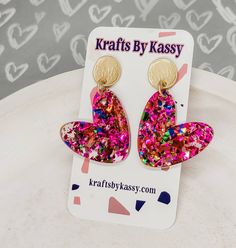 "These gorgeous glitter heart dangle earrings will have you ready for Valentine's day in no time! They're lightweight and great for all day wear! The design is cute for all year wear! Heart earrings are approximately 2\" long and assembled with hypoallergenic matte gold studs which are perfect for sensitive ears! Thank you for so much for stopping by my shop! Let me know if you have any questions or need help with anything- I am more than happy to help!" Trendy Heart Charm Earrings For Mother's Day, Trendy Heart-shaped Earrings For Birthday, Trendy Heart Earrings For Birthday, Trendy Heart-shaped Birthday Earrings, Trendy Dangle Heart Earrings For Valentine's Day, Playful Heart-shaped Earrings For Parties, Trendy Heart-shaped Earrings For Mother's Day, Playful Heart Shaped Party Earrings, Playful Heart-shaped Party Earrings