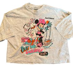 Vintage Disney South Dakota Crop- One Size Fits All. This Vintage Disney South Dakota Crop showcases Disney characters on a grey crop top. Available in open sizing (fits S-XL), with its original vintage tag intact. #vintage #vintagetshirt #disney #croptop #minniemouse Grey Crop Top, Vintage Disney, South Dakota, Vintage Tags, Vintage Tshirts, One Size Fits All, Crop Tops Women, Crop Top, Womens Tops