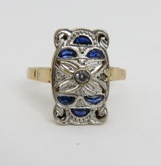 Estate wonderful art deco 18k yellow gold with platinum top sapphire diamond ring. sz 8.25. 3 grams. 16.49mm long. unmarked acid tests for 18k.great condition. estate 1920's ring. will come in great ring box. beautiufl estate piece. 3 small diamond and 6 sapphires. Collectible Yellow Gold Rings With Diamond Accents, Vintage Multi-stone Diamond Ring In Yellow Gold, Yellow Gold Multi-stone Art Deco Jewelry, Art Deco Multi-stone Yellow Gold Jewelry, Art Deco Yellow Gold Multi-stone Jewelry, Hallmarked 14k Gold Art Deco Cluster Ring, Art Deco Hallmarked 14k Gold Cluster Ring, Art Deco 14k Gold Cluster Ring Hallmarked, Art Deco Gold Sapphire Ring In 14k Gold