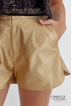 You'll feel so chic, and comfortable in our Pnina Metallic Vegan Leather Shorts. The Pnina Metallic Vegan Leather Shorts boast a sleek and stylish faux leather finish that adds a touch of sophistication to your outfit. This cruelty-free material captures the allure of genuine leather, and the high-waisted silhouette enhances your natural curves and provides a flattering, figure-hugging fit. Plus side pockets that only add a touch of convenience but also offer a subtle yet functional detail that High-waisted Leather Shorts For Summer, Leather Shorts For Night Out In Summer, Summer Leather Shorts With Pockets, Summer Leather Bottoms With Built-in Shorts, Chic Solid Shorts For Night Out, Faux Leather Short Bottoms For Day Out, Faux Leather Shorts For Day Out, Leather Shorts For Summer Party, Summer Leather Bottoms For Night Out