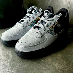 Enhance Your Kid's Sneaker Collection With These Stylish Nike Air Force 1 Low Lv8 Gs Sneakers. Designed With Synthetic Leather Upper Material And Rubber Outsole Material, These Lace-Up Sneakers Offer A Standard Shoe Width And Are Perfect For Athletic Activities. The Grey Colorway Features Graffiti Graphics That Make These Shoes Stand Out From The Rest. These Nwot Sneakers Are In Great Shape And Were Manufactured In 2020 In Vietnam. The Nike Brand Is Well-Known For Its Quality And Durability, Mak Sporty Gray Nike Custom Sneakers, Gray Custom Sneakers With Air Max Cushioning For Sports, Nike Custom Gray Sneakers For Sports, Nike Gray Low-top Sneakers, Custom Nike Gray Sneakers For Sports, Nike Gray Sneakers For Sports, Gray Running Sneakers With Branded Insole, Urban Gray Low-top Custom Sneakers, Gray Custom Sneakers With Boost Midsole For Running