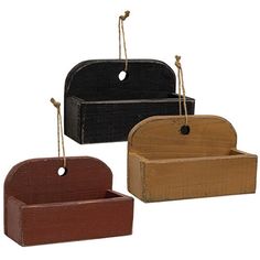 three wooden boxes with rope hanging from the top, one in black and one in brown