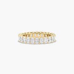 14K Yellow Gold Radiant Cut Diamond Eternity Ring (3 CTW H-I / SI1-SI2). This timeless eternity ring features the boldness and intense sparkle of radiant cut diamonds. A classic, tailored shared prongs setting allows the maximum amount of the diamonds surface to show. Number of diamonds and carat total weight will vary depending on ring size. Luxury Heirloom Diamond Cut Eternity Band, Luxury Heirloom Eternity Band With Diamond Cut, Luxury Yellow Gold Eternity Band For Wedding, Luxury Heirloom Eternity Band For Engagement, Luxury Yellow Gold Half Eternity Wedding And Engagement, Luxury Yellow Gold Eternity Band For Formal Occasions, Luxury Stackable Yellow Gold Eternity Band, Luxury Gold Eternity Band For Formal Occasions, Luxury Classic Yellow Gold Eternity Band