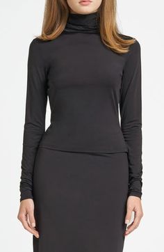 Start your layered look with this smooth, stretchy turtleneck cut for a figure-skimming fit that you'll love just as much worn on its own. Turtleneck Long sleeves 85% nylon, 15% elastane Machine wash, dry flat Imported Sleek High Neck Turtleneck For Layering, Stretch Mock Neck Top For Night Out, Sleek Turtleneck Mock Neck Top For Layering, Versatile Fitted Turtleneck For Layering, Chic Mock Neck Top For Layering, Chic Mock Neck Turtleneck Top For Layering, Chic Fitted Turtleneck For Layering, Stretch Mock Neck Top For Evening, Sleek Black Mock Neck Top