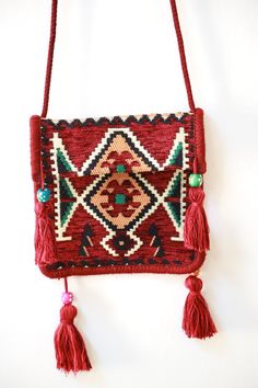 Amazing Handmade tatreez handbag embroidered with wood and tassels details in stylized design Purse traditional Palestinian Jordanian Arab A spacious and trendy Palestine traditional design tote bag to help you carry around everything that matters. Whether you're on the road, on errands, or commuting to work, you should have a Special handbag compact . Basic info: Fabric belt , one pocket Size Type: Regular Material: Fabric and Wood Color : Red, Brown, Blue , Dark Red and Multi-color Red handbag Travel Rectangular Shoulder Bag With Handwork, Red Rectangular Bags With Weaving Work, Rectangular Red Bag With Weaving Work, Traditional Handwoven Shoulder Bag Gift, Traditional Bags With Woven Motifs For Gifting, Traditional Bags With Woven Motifs As Gifts, Traditional Bags With Woven Motifs For Gifts, Traditional Rectangular Woven Bag, Handmade Folk Style Travel Bags