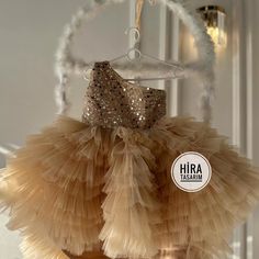 "Gold Sequin Ribbon Baby Girl Wedding Dress"  Make your little angel sparkle on her special day! ✨✨ Dress her up in this stunning Gold Sequin Baby Ribbon Girl Wedding Dress and watch her shine like a star!  ✨ Features: 🌟 Shimmering gold sequins for a glamorous look 👗 Soft and comfortable fabric for all-day wear 🎀 Delicate bow detailing for an adorable touch 💫 Fluffy tulle skirt for a princess-like feel Whether she's a flower girl or attending a wedding, this magical dress will make her the c Gold Sequined Princess Dress For Wedding, Wedding Princess Dress In Glitter Tulle, Gold Tulle Pageant Dress For Party, Wedding Princess Dress With Sequins And Glitter Tulle, Gold Glitter Tulle Princess Dress For Wedding, Gold Tulle Tutu Dress With Ruffles, Gold Tulle Princess Dress For Baptism, Gold Tulle Princess Dress For Wedding, Gold Princess Tutu Dress For Wedding