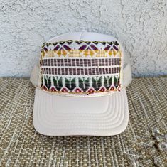 This unique, boho trucker hat for women is made using a handmade woven upcycled patch that is handstitched with contrasting thread to add more character. This hat is a perfect accessory to add style to any wardrobe and would make a great gift too!  Adjustable SnapBack closure.  Check out my other items at www.Sunlovestudio.com :) Cream Snapback Hat One Size, Trucker Cap Mini Hat One Size, Trucker Cap Mini Hat, Trucker Mini Hat With Curved Brim, Brown Baseball Cap As A Gift, Adjustable Trucker Hat For Festivals, Festival Trucker Cap With Curved Brim, Festival Trucker Hat Snapback, One Size, One Size Fits Most Snapback Trucker Hat For Festivals