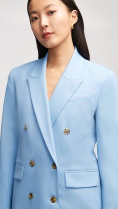 Made of an Italian Seasonless Wool, this elevated classic features traditional suiting details like a double-breasted closure, a peak label, sculpted shoulders, and interior pockets. Our Double-Breasted Blazer pairs great with a pair of chic trousers or dressed down with a classic tee and denim combo. Semi-formal Double-breasted Pantsuit With Notch Lapel, Spring Formal Pantsuit With Double Button Closure, Formal Double-breasted Pantsuit, Formal Structured Suits With Double Button Closure, Fitted Double Breasted Suit With Concealed Placket For Office, Fitted Structured Suit With Double Button Closure, Classic Structured Formal Suits, Tailored Pantsuit With Double Button Closure And Suit Collar, Formal Notched Blazer Dress With Double Button