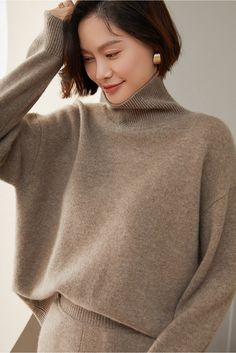 Material: 100% Cashmere Indulge in the epitome of comfort and luxury with our Turtleneck 100% Pure Cashmere Sweater. Crafted from the finest and softest cashmere, this sweater offers a warm embrace on chilly days. The classic turtleneck design not only provides added warmth but also exudes timeless sophistication. Care: To maintain its plush texture and long-lasting durability, we recommend professional dry cleaning or hand washing in cold water with a mild wool detergent. Gently reshape the swe Classic Turtleneck, Solid Color Sweater, Cashmere Sweater Women, Loose Pullover, High Neck Sweater, Long Sleeve Turtleneck, Loose Sweater, Beige Sweater, Base Coat