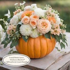 a pumpkin filled with white and orange flowers