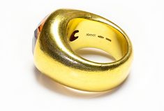 Natan Gold Citrine Ring This eye-catching ring features a bold, wide setting of 18K yellow gold, creating a dramatic backdrop for the centerpiece: a large, radiant citrine by Natan. Known for its deep golden color that echoes the warmth of sunlight, the citrine is prominently displayed, making this ring a standout choice for those who favor bold and striking jewelry pieces. Ring is currently size 7. Signed Natan 750. ANTIQUE AND VINTAGE RINGS Belperron Jewelry, Costume Jewelry Earrings, Belt Purse, Citrine Ring, Georg Jensen, Golden Color, Silver Enamel, Jewelry Rings Engagement, Ring Bracelet