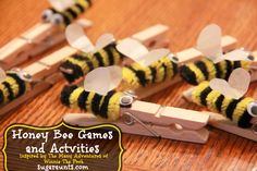 several bees are made out of popsicle sticks