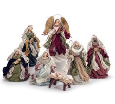 the nativity figurines have been placed on top of each other in different colors