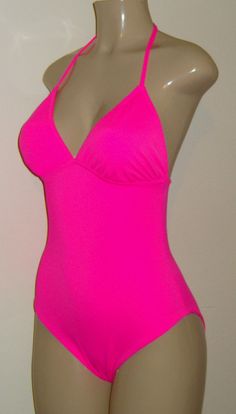 Triangle Top One Piece Swimsuit. Bathing suit styles. AA, A, B, C, D, DD, DDD cup swimsuits for women. Swimsuits for hard to fit women. Sexy one pieces. Stretch T-back Halter Top For Poolside, Fitted Backless Swimwear With Built-in Bra, Pink T-back Swimwear With Built-in Bra, Fitted Halter Neck Tankini With Built-in Bra, Stretch T-back Summer Swimwear, Halter Neck Tankini With Adjustable Straps For Sunbathing, Fitted Halter Neck Tankini For Poolside, Stretch Underwire Halter Top For Beach, Stretch Tankini With Tie Back For Sunbathing