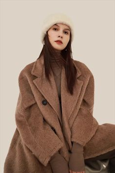 Step into winter with our Classic Long Belted Double-breasted Alpaca Wool Coat. Experience the unique warmth & elegance of Suri Alpaca. Perfect for every chilly occasion.