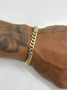 This is a 14K Yellow Gold Miami Cuban bracelet with 6.5-6.7mm links. It's made in a 14K gold semi-hollow style, which means you can still have the big bold look the Miami Cubans are well-known for but without the huge price tag. It's perfect for everyday wear. Great size for both men and women. Please be mindful of the bracelet length for those with smaller wrists. Be sure to measure wrist or ankle before purchasing.   ~ Approximately 6.5-6.7mm wide  ~ Real 14K yellow gold  ~ Semi-hollow/semi-so Cuban Link Bracelet Men Gold, Gold Bracelets For Men, Cuban Bracelet, Miami Cuban Link Chain, Miami Cuban Link, Wrist Jewelry, Mens Gold Bracelets, Miami Cuban, Men's Bracelet