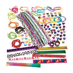 many different types of bracelets and beads are shown in this image, including one with hearts