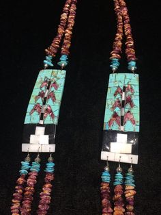 Native American Indian, Santo Domingo Pueblo artist Raymond Rosetta's unusual handmade vintage multi-stone Corn inlay, multi-strand necklace, with turquoise, purple & orange spiny oyster, mother of pearl, jet, pin shell (backing) & sterling silver beads, including handmade stamped cones at the end before adjustable finish...   Beautiful!  2 strands above Corn inlay pendants, 3 strands beneath... Corn inlay pendants are 3 3/8" x 1 1/8" x 3/16" deep.29-31" long necklace (short strand)***- Vintage Multicolor Multi-stone Jewelry, Traditional Multicolor Rectangular Necklace, Bohemian Multicolor Rectangular Jewelry, Multicolor Handmade Artisan Turquoise Necklace, Handmade Multicolor Artisan Turquoise Necklace, Artisan Multicolor Handmade Turquoise Necklace, Multicolor Hand-strung Pendant Jewelry, Turquoise Natural Stones Necklace For Collectors, One Of A Kind Rectangular Artisan Jewelry