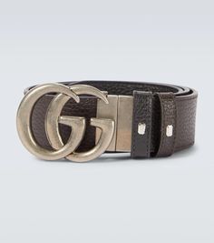 Crafted in Italy from leather, this black belt from Gucci features the label's double G buckle logo in antique silver, this style comes with punch holes for an adjustable fit. It is also reversible and comes in black and brown..Color of fastening: antique silver.Comes with dust bag.Reversible.Made in Italy.Material: calf leather.Width 3,5cm-1.5'.Buckle width 5cm-2' Designer Silver Belt With Buckle Closure, Silver Leather Belt With Logo Plaque, Silver Leather Belt Buckle With Logo Plaque, Gucci Black Belt Buckles With Removable Belt, Designer Silver Leather Belt, Gucci Designer Leather Belt, Luxury Gucci Leather Belt, Designer Leather Belt Buckles With Metal Logo, Luxury Silver Belt With Buckle Closure