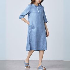 Elevate your summer style with our luxurious blue linen tunic dress. Made from pure linen, this dress combines casual ease with sophisticated elegance. The dress features convenient pockets for practicality, making it the perfect choice for any occasion. Experience the comfort and refinement of linen with our dress. FEATURES 100% linen No lining Stand up collar Half sleeve Front Button closure Two side pockets Loose fit dress Below knee length Perfect for summer,spring,autumn More color ★★ Bespo Spring Linen Midi Dress, Casual Blue Linen Dress For Daywear, Casual Light Blue Linen Summer Dress, Casual Blue Linen Dress For Day Wear, Casual Light Blue Linen Dress For Spring, Blue Relaxed Fit Linen Summer Dress, Casual Blue Linen Dress, Casual Linen Midi Dress For Vacation, Elegant Linen Dress With Pockets And Relaxed Fit