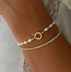 Simple and elegant pearl bracelet! Pairs nicely with other bracelets, but is also beautiful on it's own. Includes .5" extender. Materials: 14K Gold Plated / Pearls Elegant Silver Pearl Bracelet, Elegant Adjustable Gold Bracelet With Pearl Charm, Elegant Pearl Charm Bracelet, Gold Plated Round Pearl Bracelet For Formal Occasions, Anniversary Pearl Bracelets With Jubilee Bracelet, Pearl Jubilee Bracelet For Anniversary, Elegant Adjustable Charm Bracelet With Pearl, Elegant Adjustable Pearl Charm Bracelet, Elegant Gold Adjustable Pearl Bracelet