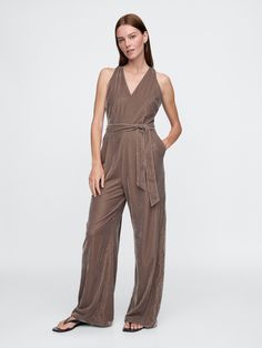 Soft velvet jumpsuit.  V-neck.  Sleeveless.  Tie-belt at waist.  Front slant pockets.  This jumpsuit is made with 100% recycled polyester.  Compared to virgin materials, using recycled materials helps to reduce resource use and waste.  Fit: Classic.  A fit & flare silhouette with an easy fit.  Models wearing Gap Plymouth Rock, Fit Models, Velvet Jumpsuit, Toddler Gifts, Tie Belt, Soft Velvet, Plymouth, Fit & Flare, Recycled Materials