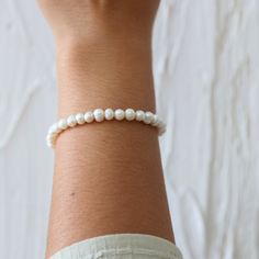 Make an Everyday Statement with Our Elegant Pearl Bracelet - A Timeless Essential for Effortless Elegance: Hypoallergenic, Tarnish-Free, and Water-Resistant for Unmatched Quality. Introducing our exquisite Everyday Statement Pearl Bracelet, a true embodiment of modern style and sophistication. This stunning bracelet is designed to gracefully elevate your everyday look, making it a must-have accessory that effortlessly stands out. Crafted with meticulous attention to detail, our Everyday Statemen Adjustable Classic Pearl Bracelet For Everyday, Classic Adjustable Pearl Bracelet, Classic Adjustable Hypoallergenic Pearl Bracelet, Everyday Single Strand Bracelets, Everyday White Pearl Jubilee Bracelet, Delicate Adjustable Hypoallergenic Bracelets, Delicate White Hand-strung Bracelets, White Hypoallergenic Pearl Bracelet, Hypoallergenic Flexible Beaded Bracelets