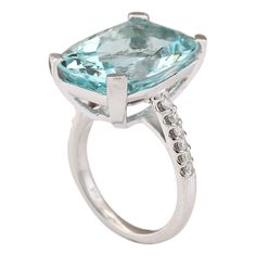 Stamped: 14K White Gold Total Ring Weight: 9.8 Grams Ring Length: N/ARing Width: N/A Gemstone Weight: Total Natural Aquamarine Weight is 14.03 Carat (Measures: 18.35x14.10 mm) Color: Blue Diamond Weight: Total Natural Diamond Weight is 0.30 Carat Quantity: 12 Color: F-G, Clarity: VS2-SI1 Face Measures: 18.35x14.10 mm Sku: [703560W] Aquamarine Brilliant Cut Diamond Ring For Formal Occasions, Formal Aquamarine Diamond Ring With Brilliant Cut, Luxury Aquamarine Diamond Ring With Prong Setting, Luxury 14k White Gold Rings With Gemstone, Classic Aquamarine Rings For Formal Occasions, Luxury 14k White Gold Topaz Ring, Luxury Cushion Cut Gemstones With Prong Setting, Modern Platinum Gemstone Rings, Formal Aquamarine Diamond Ring With Prong Setting