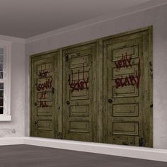 an empty room with graffiti on the doors