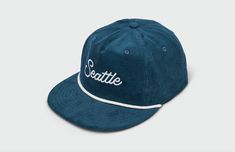 This Seattle Script 5 Panel Hat features quality cotton corduroy and rope detailing. The hip vintage flatbill design keeps the sun out of eyes, and the adjustable snapback closure ensures a personalized, comfortable fit. This hat is perfect for any fan of the Emerald City. 100% Cotton Corduroy Cap Matching Corduroy UnderVisor Vintage Lightly Structured Fit Snapback Closure Medium Crown One Size Fits Most Adults (6 7/8 to 7 3/4) Made in the USACut and Sewn in Kansas City, MO Adjustable Cotton Snapback Trucker Hat, Trendy Corduroy Snapback Baseball Cap, Everyday Corduroy Snapback Baseball Cap, Casual Corduroy Snapback Baseball Cap, Casual Corduroy Snapback Hat For Streetwear, Adjustable Cotton Fitted Hat With Flat Brim, Corduroy Trucker Hat With Curved Brim For Streetwear, Retro Adjustable Cotton Trucker Hat, Retro Corduroy Snapback Baseball Cap