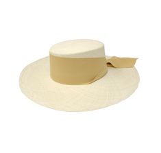 Long Brim Cordovan Hat With Maxi Bow The Panama Hat, also known as Montecristi Hat is a traditional Ecuadorian model made with 100% Toquilla Straw, a natural fiber known for its quality and beauty. The perfect beach-to-city accessory, elegant, yet fresh and versatile for original matches with different kinds of fashion. -We ship with DHL Express. Shipping takes approximately 3 to 5 days to arrive depending on the destination. -Need Help? Please contact: customercare@sensistudio.com -All Sales Ar Beige Woven Straw Hat Bands, Beige Woven Wide Brim Fedora, Beige Wide Brim Woven Fedora, White Flat Crown Straw Hat For Kentucky Derby, White Flat Crown Hat Bands For Beach, White Brimmed Boater Hat In Toquilla Straw, Cream Brimmed Fedora In Toquilla Straw, White Brimmed Toquilla Straw Boater Hat, Cream Brimmed Toquilla Straw Fedora