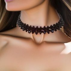 This Black Crystal Choker is a exquisite accessory is a fusion of elegance and mystique, designed to adorn your neckline with a touch of dark sophistication. Crafted meticulously, the choker comprises two layers of meticulously arranged black crystal rondelles, each 4mm and 6mm in size. These crystals have been carefully selected to create a mesmerizing play of light and shadows, ensuring that the choker sparkles with every subtle movement you make. The moment you shift, the choker comes alive w Edgy Black Choker For Festivals, Adjustable Black Choker For Party, Black Choker For Night Out, Adjustable Black Jewelry For Night Out, Edgy Halloween Party Jewelry, Elegant Jewelry For Halloween Costume Party, Elegant Halloween Jewelry For Costume Party, Edgy Halloween Party Choker, Black Punk Jewelry For Costume Party