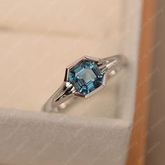 This ring features a 6*6mm asscher cut london blue topaz and sterling silver finished with rhodium. Customization is available. It is made by hand, and it will take about 7 days to finish the ring after your payment is completed. Any question, just let me know. :) My shop homepage: https://www.etsy.com/shop/LuoJewelry?ref=l2-shopheader-name Luo Jewelry, Emerald Cut Solitaire Ring, Wholesale Jewelry Supplies, Mystic Topaz Ring, Ring Emerald Cut, Pear Cut Engagement Rings, Ring Rosegold, Birthstone Rings, Zierlicher Ring