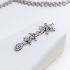 Radiant White Gold Diamond Necklace Set - the perfect addition to any sophisticated ensemble. Crafted from 18k white gold and weighing 24.1 grams, this piece features stunning round diamonds with a total weight of 2.96ct, set in a beautiful 17.5" necklace with a 1.25" drop length. It also comes with matching earrings with a length of 1.25" and screw backs for secure wearing. The lobster lock ensures this set stays safely in place, making it the perfect accessory for any occasion. PRODUCT DETAILS Platinum Diamond Necklace Fine Jewelry, Exquisite White Gold Diamond Necklace With Brilliant Cut, Exquisite Platinum Diamond Necklace In White Gold, Exquisite White Gold Diamond Necklace In Platinum, Silver Bridal Necklace With Single Cut Diamonds In Platinum, Silver Platinum Bridal Necklace With Single Cut Diamonds, Dazzling White Gold Flower Pendant Diamond Necklace, Formal White Gold Diamond Pendant Necklace, Formal White Gold Cross Pendant Necklace