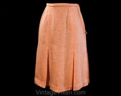 This 1960s pastel skirt has a tapered waist with a slim waistband and A-line silhouette, tailored in princess seams that open into kicky walking pleats. It's a classic 60s secretary style, pinky peach in a beautiful vintage wool blend tweed, perfect for spring. Deadstock with an original $12.95 price tag from forty years ago... this would be $100 in today's dollars!  Ladies' Size  2 to 3    Measurements  Waist 24, Hip 36; Length 25.5 to 26 Inches    Era  1960s    Label  ' Majestic ' on the hange 60s Secretary, Secretary Style, Pastel Skirt, Etiquette Vintage, Coral Peach, Princess Seams, Princess Seam, Price Tag, Vintage Wool