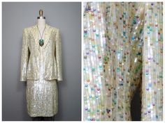 "This is a RARE and AMAZING vintage dress suit! Both pieces are beautifully detailed with sequins all over and accented with beading along the hems. It's in PERFECT condition! Note, measurements are taken with the front brought together, there are no closures on the blazer. Bust - 36/38\" Shoulders - 16\" Sleeves - 24.5\" Length of Jacket - 26\" Skirt Waist - 27\" Hips - 38\" Length of Skirt - 23\" Tag Size - 4 This item comes from a pet-free and smoke-free home. If you would like more info or h Spring Embellished Fitted Sets, Spring Embellished Party Sets, Elegant Festive Sets For Cocktail Occasions, Elegant Festive Sets For Cocktail, Spring Party Embellished Sets, Elegant Festive Cocktail Sets, Embellished Formal Sets For Summer, Formal Fitted Sequin Sets, Glamorous Fitted Silk Set