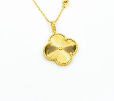 Luck will always be on your side with our Vintage Clover Pendant Necklace in Gold. Show off your unique style with this one-of-a-kind piece that adds a touch of elegance and charm to any outfit. A perfect gift for someone special (or yourself!), this necklace is sure to bring good fortune wherever you go. Who needs a four-leaf clover when you have this stunning pendant around your neck? Go ahead, make a statement and embrace your inner fashionista! ADDITIONAL INFORMATION Color: Gold Stone: no Re Luxury Gold Jewelry With Large Pendant, Formal Yellow Gold Flower Pendant Necklace, Classic Gold Necklaces With Large Pendant, Classic Gold Necklace With Large Pendant, Gold Flower Pendant Jewelry With Polished Finish, Fine Jewelry Gold Necklace With Flower Pendant, Exquisite Gold Necklace With Large Pendant, Yellow Gold Jewelry With Polished Flower Pendant, Exquisite Yellow Gold Jewelry With Large Pendant