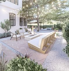 an outdoor living area with patio furniture and string lights