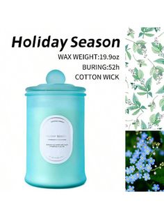 a blue candle with green leaves on it next to a white background and the words holiday season wax weight 19oz burning 32h cotton wick