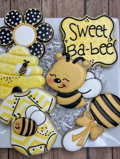 decorated cookies in the shape of honeybees and bees