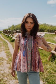 This top is cute, lightweight and perfect for summer! Mixed wallpaper print Waive smocked bodice Flutter sleeve top 65% rayon 35% polyester Model is 5'8" and wearing a size small. Small: 2-4 Medium: 6-8 Large: 10-12 Flowy Short Sleeve Blouse With Smocked Bodice, Flowy Smocked Bodice Top With Flutter Sleeves, Bohemian Floral Print Tops With Butterfly Sleeves, Bohemian Tops With Floral Print And Butterfly Sleeves, Multicolor Flowy Tops With Flutter Sleeve, Feminine Blouse With Smocked Bodice And Flutter Sleeves, Flowy Multicolor Flutter Sleeve Tops, Flowy Ruffle Sleeve Printed Blouse, Summer Printed Blouse With Butterfly Sleeves