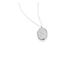 Keep your loved ones close to your heart - this classic locket pendant opens to reveal space for two images, with an elegant monogram on the front. The long length of the chain makes a distinctive style statement. Made in New York from the highest-quality metals, it was designed by Zahava, whose Sarah Chloe line of jewelry has become a favorite among those who understand next-generation personalization.  Locket: 1.25" h x 1" w; Chain length: 36"  .925 sterling silver or 18k yellow gold-plate.  S Engraved Elegant Locket Necklace, Classic Oval Link Personalized Necklace, Classic White Gold Initial Necklace, Elegant Personalized Pendant Locket Necklace, Elegant Locket Necklace With Cable Chain For Gifts, Everyday Sterling Silver Locket Necklace, Classic White Gold Locket Necklaces, Classic White Gold Locket Necklace, Elegant Keepsake Jewelry With Initials