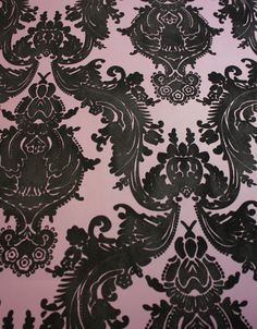 black and white wallpaper with an ornate design on the top half of it's surface